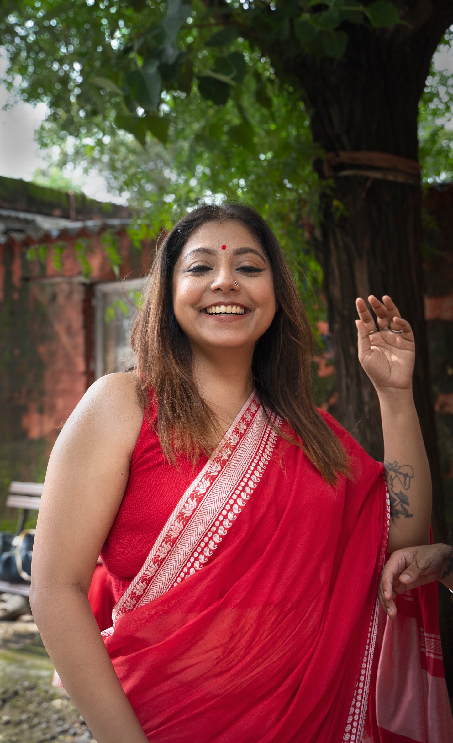 Devii Saree – Red premium cotton with lotus & paisley border, honoring everyday women