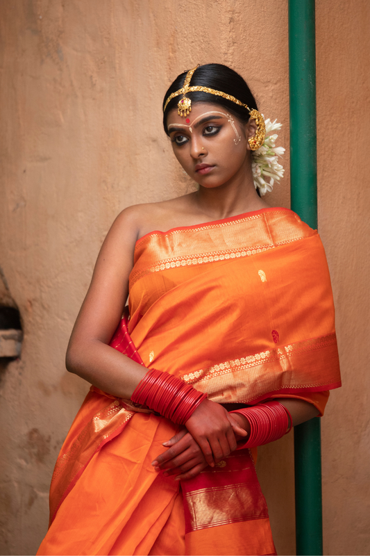Kesariya - Indiestore Orange Handloom Maheshwari Saree with Golden Red Border